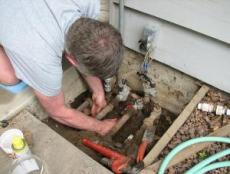 Ron inspects valves as part of a Boca Raton irrigation repair job